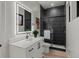 Contemporary bathroom with a walk-in shower and a vanity featuring an illuminated mirror at 2580 Saddleback Dr, Castle Rock, CO 80104