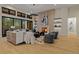 Inviting living room with a cozy fireplace, elegant decor, and large windows at 2580 Saddleback Dr, Castle Rock, CO 80104