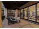 Relaxing patio with comfortable lounge chairs, offering an inviting space for outdoor relaxation with access to the living room at 2580 Saddleback Dr, Castle Rock, CO 80104