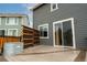 View of the back deck featuring wood-look floors, a divider, and a metal tub at 643 Ranchhand Dr, Berthoud, CO 80513