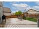 Exterior view of backyard featuring a grill, metal tub, and deck at 643 Ranchhand Dr, Berthoud, CO 80513
