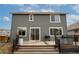 Exterior view of backyard featuring a wood-look deck with gray siding at 643 Ranchhand Dr, Berthoud, CO 80513
