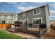 Exterior view of backyard featuring a deck with gray siding at 643 Ranchhand Dr, Berthoud, CO 80513