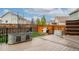 View of backyard featuring two metal tubs on wood-look deck at 643 Ranchhand Dr, Berthoud, CO 80513
