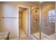 Bathroom showcases a tiled shower with a decorative window and access to a walk-in closet at 643 Ranchhand Dr, Berthoud, CO 80513
