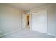 Bedroom featuring neutral carpeting, paint, a closet, and an open door to another room at 643 Ranchhand Dr, Berthoud, CO 80513