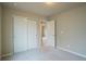 Bedroom featuring neutral carpeting, paint, a closet, and an open door to another room at 643 Ranchhand Dr, Berthoud, CO 80513