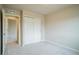 Bedroom featuring neutral carpeting, paint, a closet, and an open door to another room at 643 Ranchhand Dr, Berthoud, CO 80513