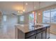Open concept kitchen with island, stainless steel sink, and laminate floors throughout at 643 Ranchhand Dr, Berthoud, CO 80513