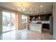 Modern kitchen features dark cabinetry, stainless steel appliances, and granite countertops at 643 Ranchhand Dr, Berthoud, CO 80513