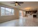 Bright living area with large windows, patio doors, and views of the kitchen at 643 Ranchhand Dr, Berthoud, CO 80513
