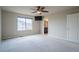 Large primary bedroom suite with window and neutral walls at 643 Ranchhand Dr, Berthoud, CO 80513