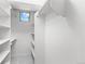 Organized walk-in closet with ample shelving, providing efficient storage solutions at 2745 Java Ct, Denver, CO 80211