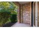 Charming entrance featuring unique stonework, tidy landscaping and a modern glass storm door at 2745 Java Ct, Denver, CO 80211