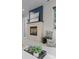 Living room fireplace with stone surround, dark mantle and an accent wall at 2745 Java Ct, Denver, CO 80211