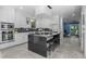 Spacious kitchen with stainless steel appliances, large island, and sleek cabinetry at 2745 Java Ct, Denver, CO 80211