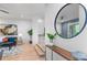 Open floor plan of the living room shows the entry with modern touches and staircase access at 2745 Java Ct, Denver, CO 80211