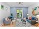 Cozy living room with stylish furniture, neutral colors, bright windows, and an outside view at 2745 Java Ct, Denver, CO 80211