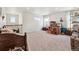 Large bonus room with neutral walls, carpet, and several windows providing great natural light at 14938 Vienna Cir, Parker, CO 80134