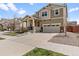 Charming two-story home with a well-maintained front yard, inviting porch, and attached two-car garage at 14938 Vienna Cir, Parker, CO 80134