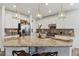 Modern kitchen with granite countertops, stainless steel appliances, and a large central island at 14938 Vienna Cir, Parker, CO 80134