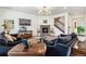 Spacious living room featuring a cozy fireplace, large TV, and comfortable seating area at 14938 Vienna Cir, Parker, CO 80134
