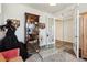 This office space includes a beautiful display cabinet, a glass desk and an open doorway at 14938 Vienna Cir, Parker, CO 80134