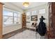 Bright office space with light-colored walls, hardwood flooring and a large window with neighborhood views at 14938 Vienna Cir, Parker, CO 80134