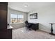 Office featuring a black desk and chair with a large window providing natural light at 14938 Vienna Cir, Parker, CO 80134