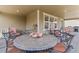 Cozy patio with stylish outdoor furniture and a dining table, perfect for entertaining guests and enjoying meals at 14938 Vienna Cir, Parker, CO 80134