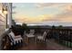 A fenced back deck with a grill, patio furniture, and view of the neighborhood at 7536 Grady Cir, Castle Rock, CO 80108