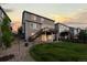 Spacious backyard features a well-maintained lawn, rock landscaping, and a large deck accessible from the second story at 7536 Grady Cir, Castle Rock, CO 80108