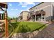 A well-manicured backyard featuring a lush lawn, deck, and a play area is perfect for outdoor activities at 7536 Grady Cir, Castle Rock, CO 80108
