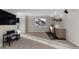 Finished basement with a wet bar, a large window, neutral carpet, and a decorative brick wall with shelving at 7536 Grady Cir, Castle Rock, CO 80108