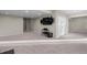 Finished basement with media setup, neutral color palette and access to other rooms at 7536 Grady Cir, Castle Rock, CO 80108