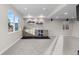 Basement featuring a stylish wet bar, beverage cooler, stone wall accent, and recessed lighting at 7536 Grady Cir, Castle Rock, CO 80108
