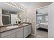 Bathroom featuring a double vanity, ample storage, and a walk-in shower at 7536 Grady Cir, Castle Rock, CO 80108