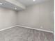 Empty basement bedroom with neutral carpeting, neutral walls, and overhead lighting at 7536 Grady Cir, Castle Rock, CO 80108