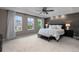 Primary bedroom with accent wall, ceiling fan, and plenty of natural light at 7536 Grady Cir, Castle Rock, CO 80108