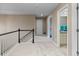 The carpeted hallway features a white stair rail, a bathroom, and other doorways at 7536 Grady Cir, Castle Rock, CO 80108