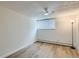 Bright, vacant bedroom with wood floors, a ceiling fan, and a window for natural light at 1050 N Lafayette St # 101, Denver, CO 80218