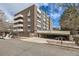 Brick apartment building showcasing a covered parking area and multiple balconies at 1050 N Lafayette St # 101, Denver, CO 80218