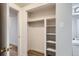 Bedroom closet with built-in shelving provides ample storage space at 1050 N Lafayette St # 101, Denver, CO 80218