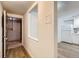 Hallway view leading to a kitchen, highlighting open layout and modern flooring at 1050 N Lafayette St # 101, Denver, CO 80218