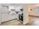 Bright kitchen featuring white cabinets, modern appliances, and neutral countertops for a clean aesthetic at 1050 N Lafayette St # 101, Denver, CO 80218