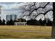 Scenic view of a park with a white apartment building in the background at 1050 N Lafayette St # 101, Denver, CO 80218