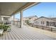 Covered back porch overlooking the yard and neighboring homes at 946 Compass Dr, Erie, CO 80516