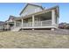 Beautiful backyard with lush grass, and large covered porch for outdoor entertainment at 946 Compass Dr, Erie, CO 80516
