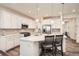 Bright kitchen featuring stainless appliances, pendant lights, and a breakfast bar with seating at 946 Compass Dr, Erie, CO 80516