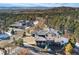 Panoramic aerial showing the house in a mountain community with views of other homes and rolling hills at 1803 Avenida Del Sol, Castle Rock, CO 80104